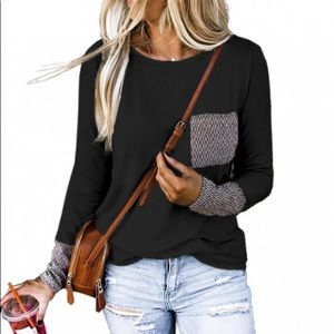 Black long sleeve top with chevron pockets…
